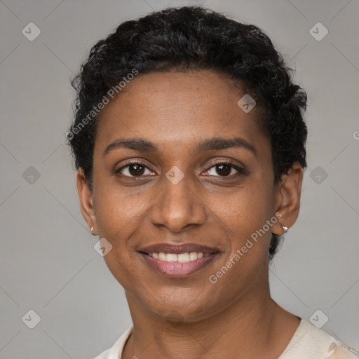 Joyful black young-adult female with short  brown hair and brown eyes