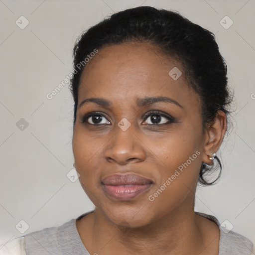 Joyful black young-adult female with medium  black hair and brown eyes