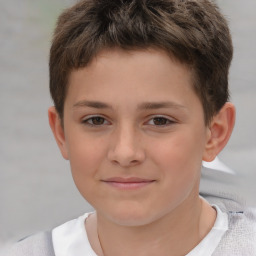 Joyful white child male with short  brown hair and brown eyes