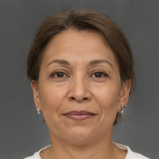 Joyful white adult female with short  brown hair and brown eyes