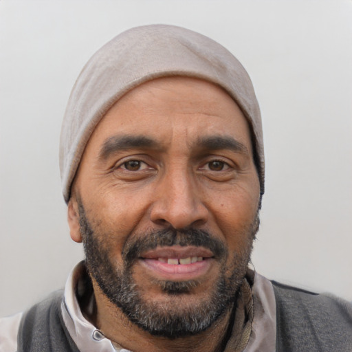 Joyful white adult male with short  black hair and brown eyes