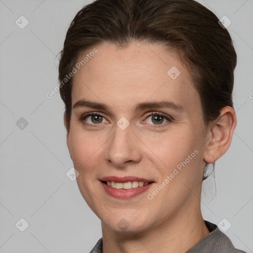 Joyful white young-adult female with medium  brown hair and grey eyes