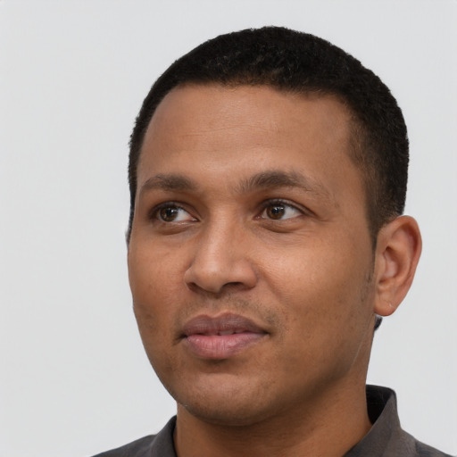 Neutral black young-adult male with short  black hair and brown eyes