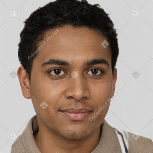 Joyful black young-adult male with short  brown hair and brown eyes