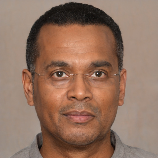 Neutral black adult male with short  black hair and brown eyes