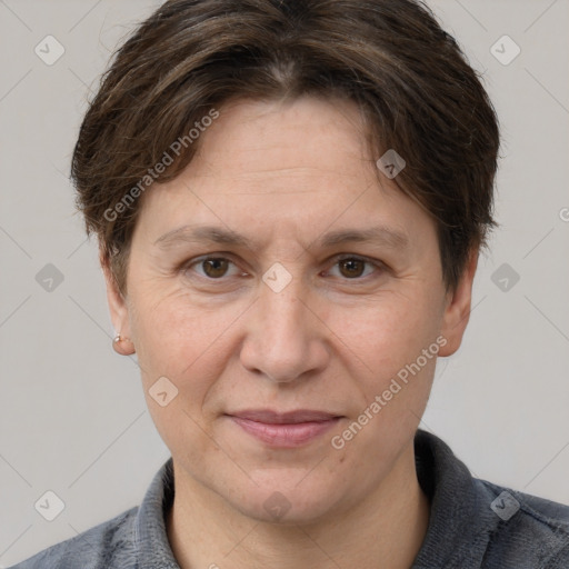 Joyful white adult female with short  brown hair and grey eyes