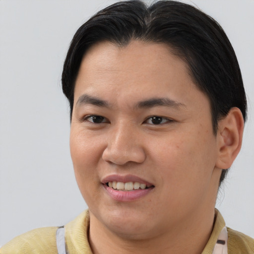 Joyful asian young-adult female with short  brown hair and brown eyes