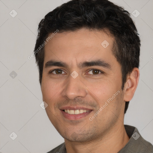 Joyful white young-adult male with short  black hair and brown eyes