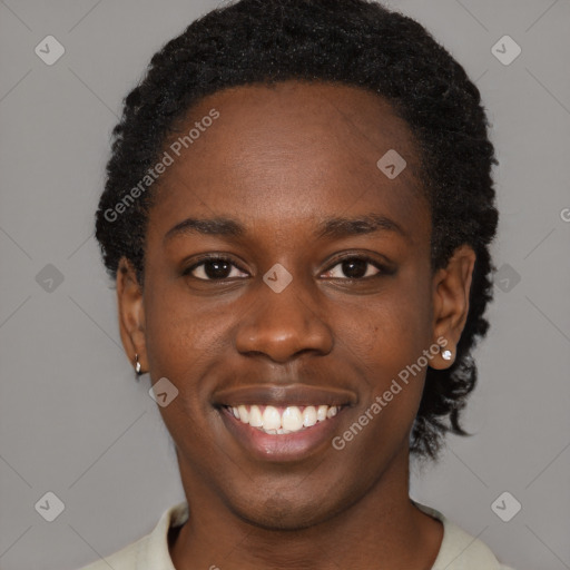 Joyful black young-adult female with short  black hair and brown eyes