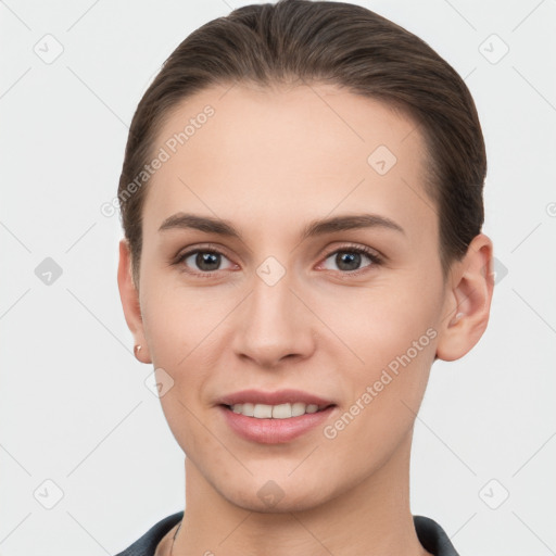 Joyful white young-adult female with short  brown hair and brown eyes