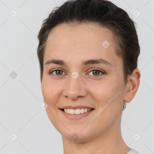 Joyful white young-adult female with short  brown hair and brown eyes