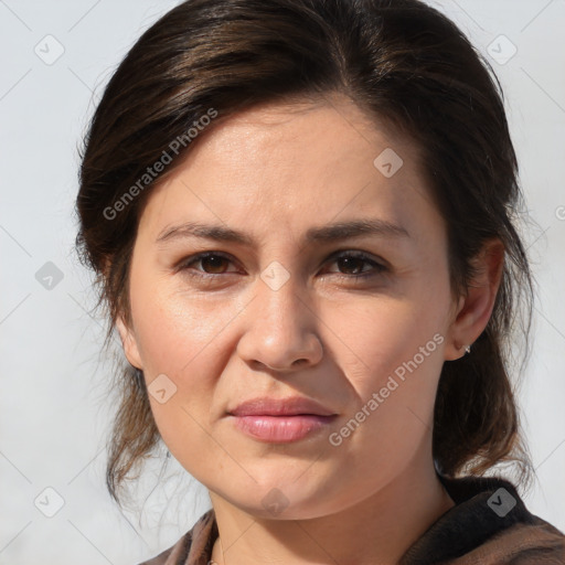 Joyful white adult female with medium  brown hair and brown eyes