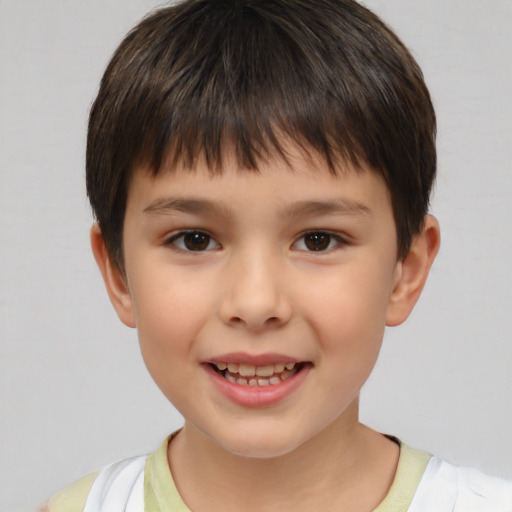 Joyful white child male with short  brown hair and brown eyes
