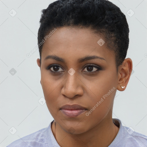 Joyful black young-adult female with short  black hair and brown eyes