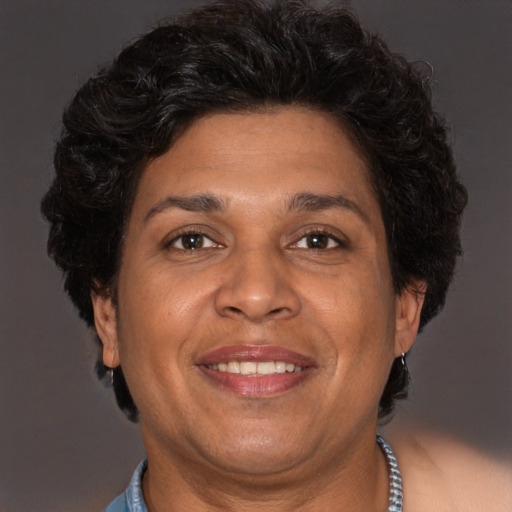 Joyful white adult female with short  brown hair and brown eyes