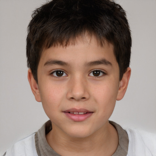 Joyful white child male with short  brown hair and brown eyes