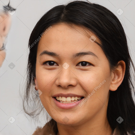 Joyful asian young-adult female with medium  brown hair and brown eyes