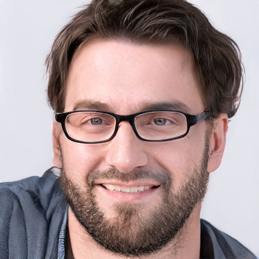 Joyful white young-adult male with short  brown hair and blue eyes