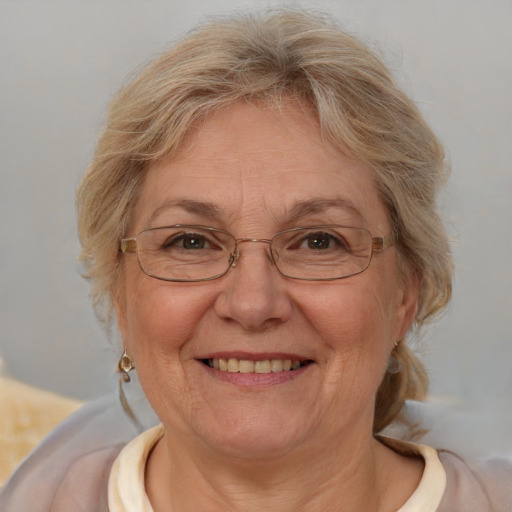 Joyful white middle-aged female with medium  brown hair and blue eyes