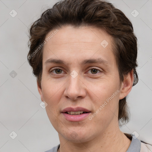 Joyful white adult female with short  brown hair and grey eyes