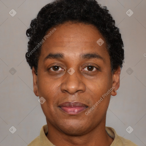 Joyful black adult female with short  black hair and brown eyes
