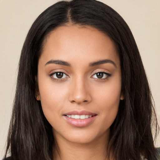 Joyful white young-adult female with long  black hair and brown eyes