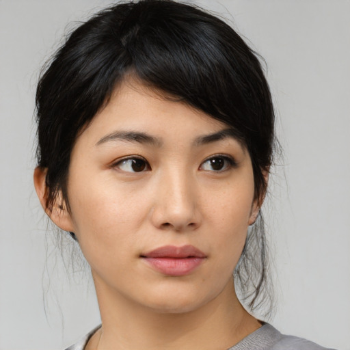 Neutral asian young-adult female with medium  brown hair and brown eyes