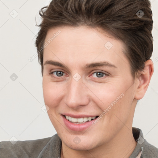 Joyful white young-adult female with short  brown hair and brown eyes