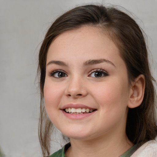 Joyful white young-adult female with medium  brown hair and green eyes