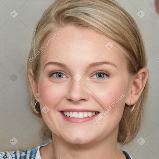 Joyful white young-adult female with medium  brown hair and blue eyes