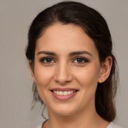 Joyful white young-adult female with medium  brown hair and brown eyes