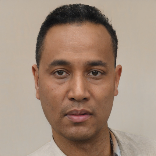Neutral black young-adult male with short  black hair and brown eyes