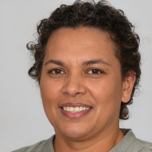 Joyful white adult female with short  brown hair and brown eyes