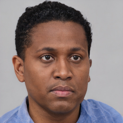 Neutral black young-adult male with short  brown hair and brown eyes