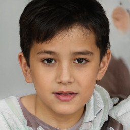 Joyful white child male with short  brown hair and brown eyes