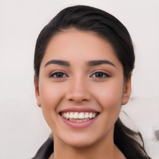 Joyful white young-adult female with medium  black hair and brown eyes