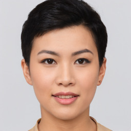 Joyful asian young-adult female with short  black hair and brown eyes