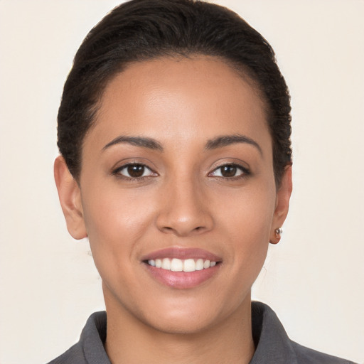 Joyful white young-adult female with short  brown hair and brown eyes