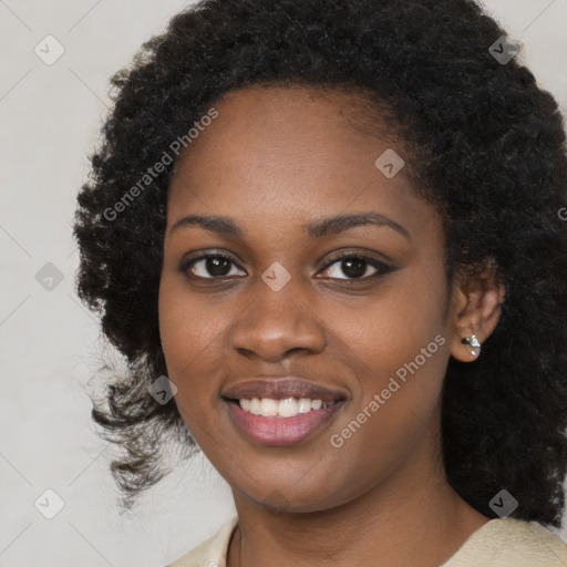 Joyful black young-adult female with medium  black hair and brown eyes