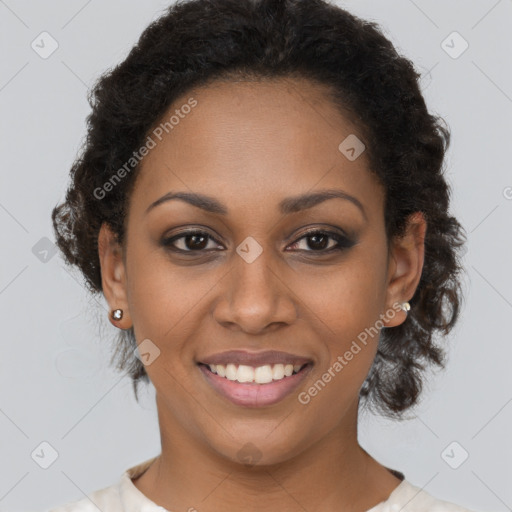 Joyful black young-adult female with long  brown hair and brown eyes