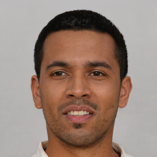 Neutral latino young-adult male with short  black hair and brown eyes