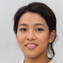 Joyful asian young-adult female with medium  black hair and brown eyes