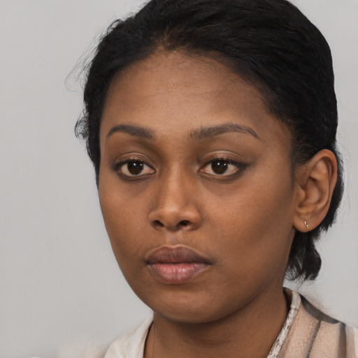 Neutral black young-adult female with short  black hair and brown eyes