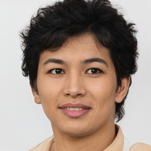 Joyful asian young-adult female with short  brown hair and brown eyes