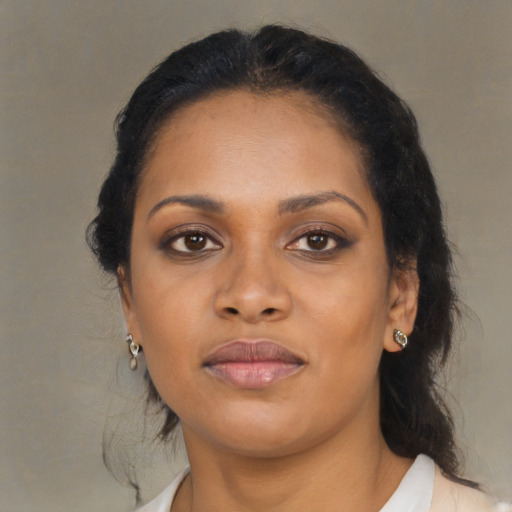 Neutral black young-adult female with medium  brown hair and brown eyes