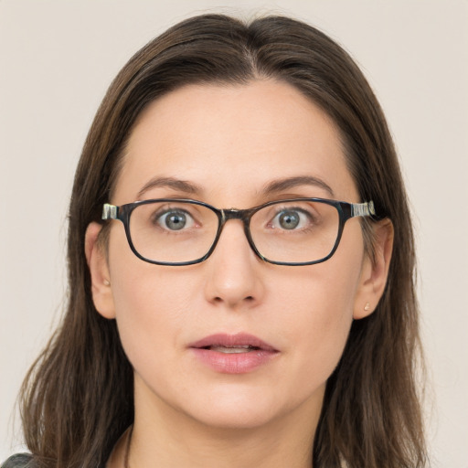 Neutral white young-adult female with long  brown hair and brown eyes