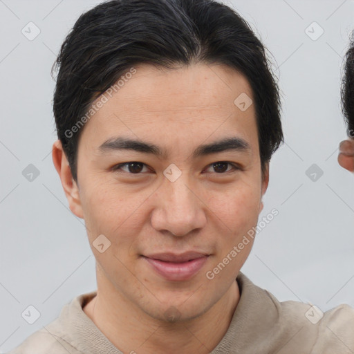 Joyful asian young-adult male with short  brown hair and brown eyes