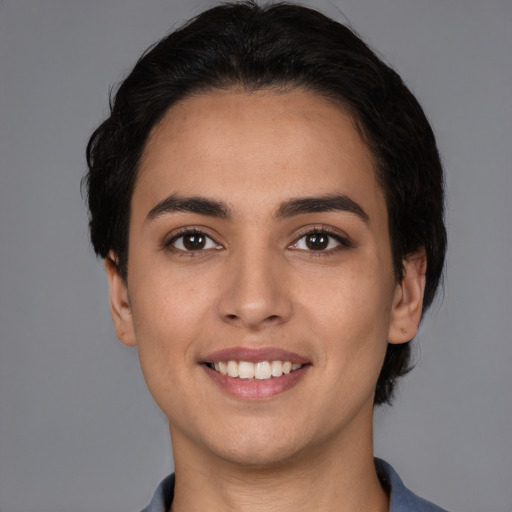 Joyful white young-adult female with short  brown hair and brown eyes