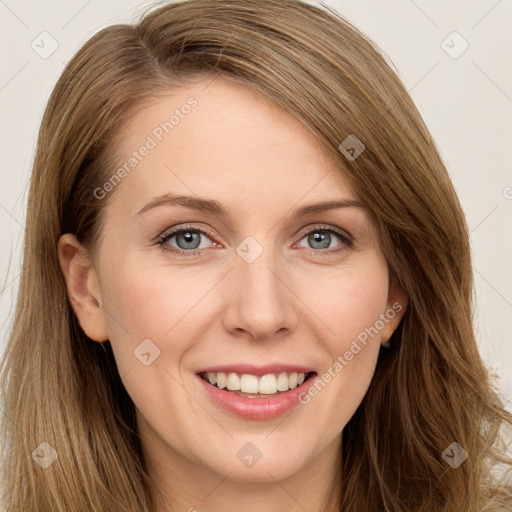 Joyful white young-adult female with long  brown hair and blue eyes