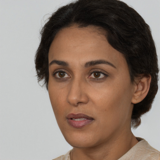 Neutral white young-adult female with short  brown hair and brown eyes